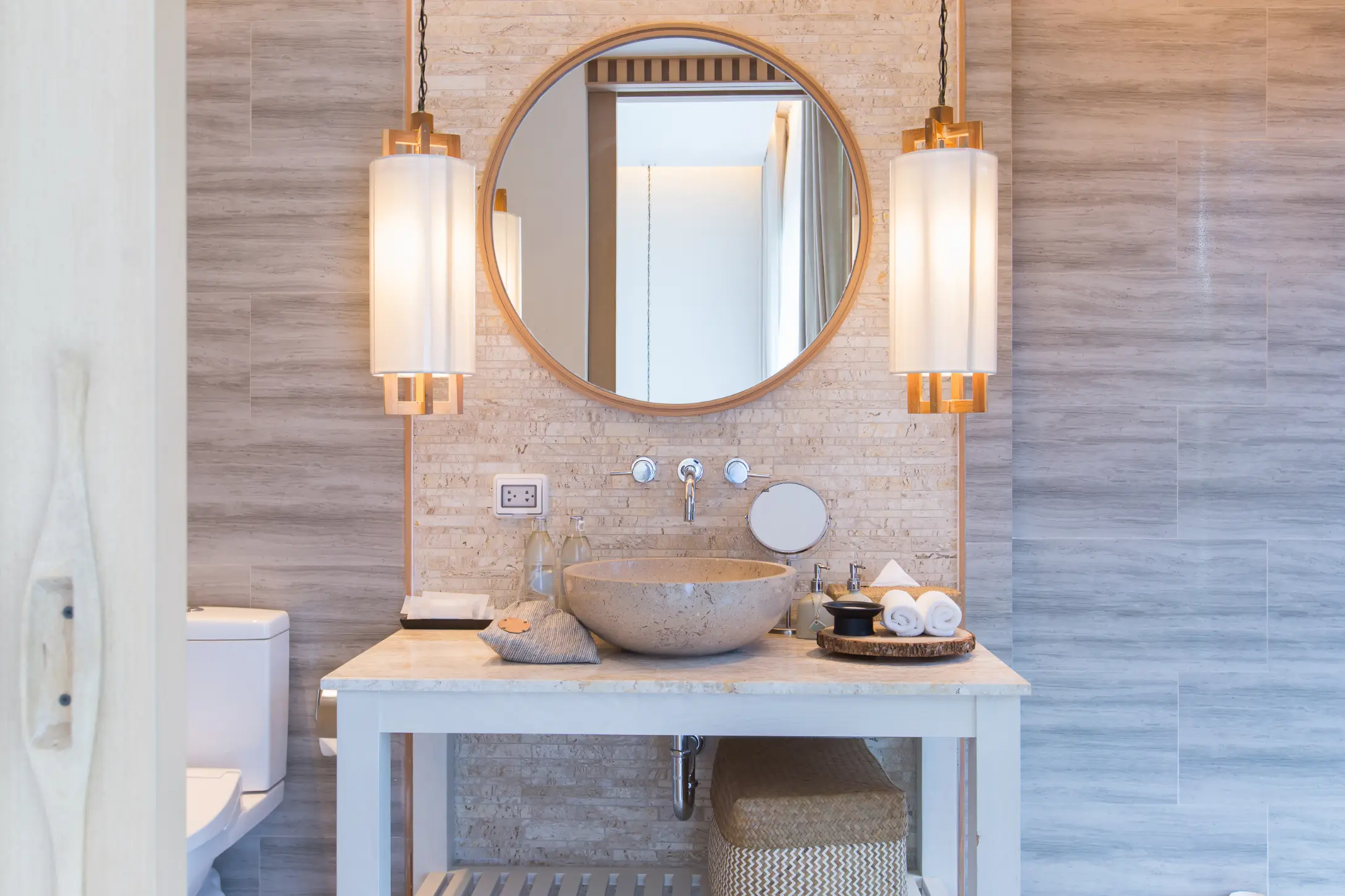 Interior of bathroom with washbasin faucet and white towel